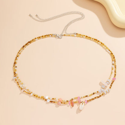 Chaîne de Ventre Coquillage Cauri Bohème en Perles dorées Roses