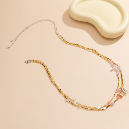 Chaîne de Ventre Coquillage Cauri Bohème en Perles dorées Roses